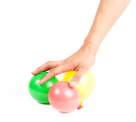 Hand holding colorful helium balloons isolated on white backgrou