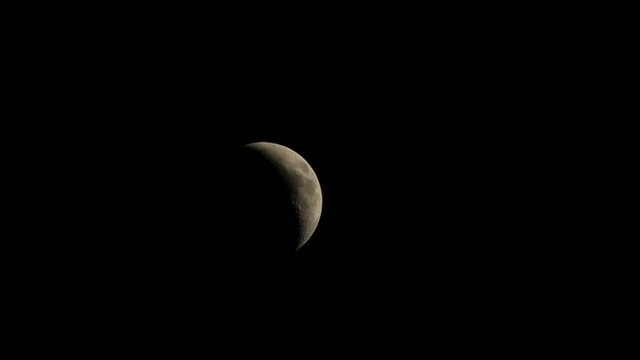 Moon moving across clouds. Timelapse, 720p.