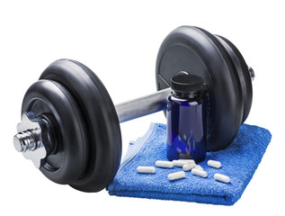 dumbbell and pills isolated on white background