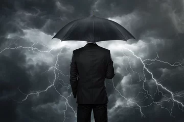 Fotobehang Businessman with umbrella standing in front of storm © rangizzz