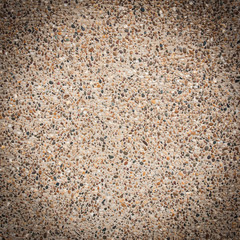 closeup of textured brown wall, made of small rocks