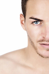 Obraz premium Portrait of a sportive young man isolated on white half face