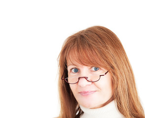 Intelligent businesswoman wearing reading glasses