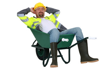 craftsman sitting in a wheelbarrow