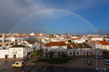 Rainbow over the city of Tavira, Portugal