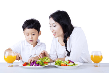 Encourage child to eat green - isolated