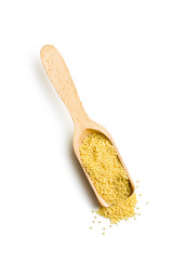 millet in wooden scoop