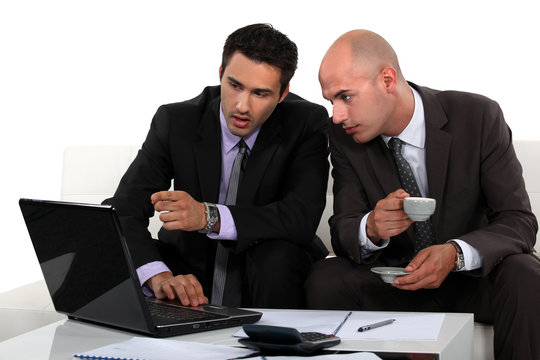 Business professionals discussing a report