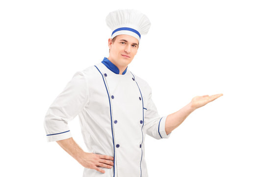 Male chef in a uniform gesturing with hand