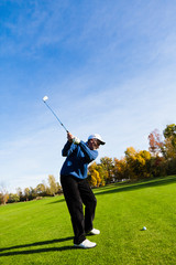 Man playing golf