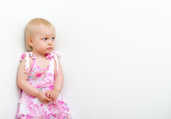 Little girl punished and standing in the corner