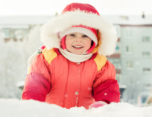 Beautiful happy girl in the red jacket