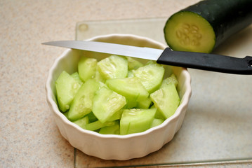 Cucumber Slices With a Knife