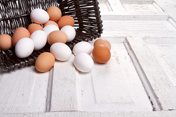 brown eggs spilling out of a basket