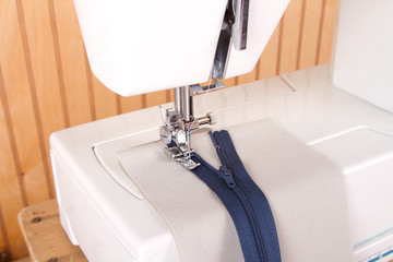 sewing a zipper on sewing machine © sjhuls