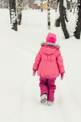 Beautiful happy girl in the red jacket