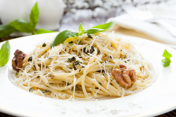 delicious Spaghetti with walnuts and parmesan on a plate