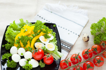 vegetable spring salad and quail eggs