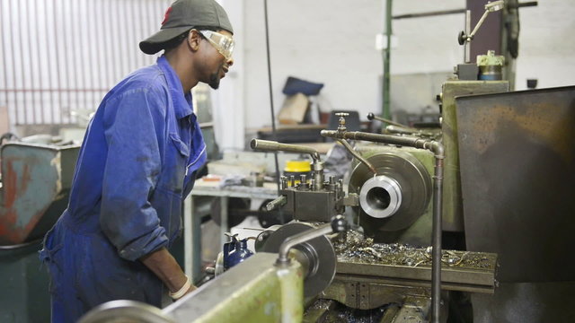 An industrial service repairmen labouring in workshop