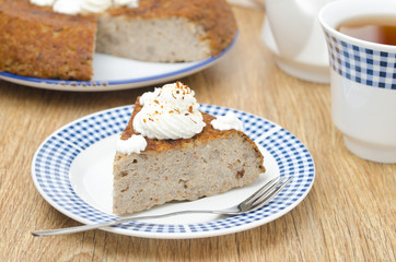 Fototapeta na wymiar piece of buckwheat cake (krupenik) with curd cream horizontal