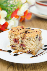 piece of cake with dried cranberries and walnuts