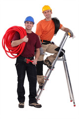 Two electricians working together