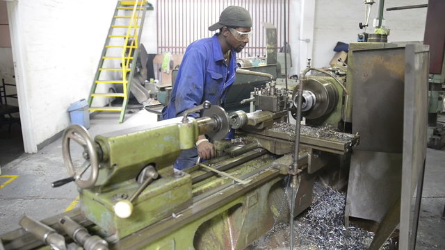 An industrial service repairmen labouring in workshop