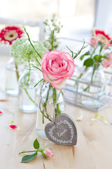 Fresh flowers in little vintage bottles