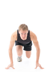 Fototapeta premium a young sporty man on white background