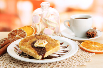 White bread toast with chocolate and cup of coffee in cafe