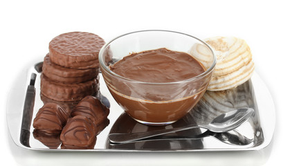 Bowl of chocolate and sweets isolated on white