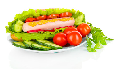 Tasty hot dog with vegetables isolated on white