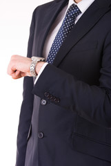 Businessman checking time on his wristwatch.