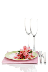Festive table setting with flowers isolated on white