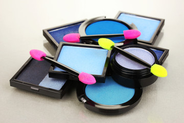 Bright eye shadows and sponge brushes for foundation