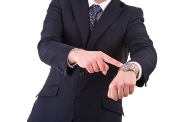 Businessman pointing at his wristwatch.