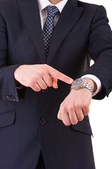 Businessman pointing at his wristwatch.