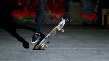 Skater rolling into kickflip trick