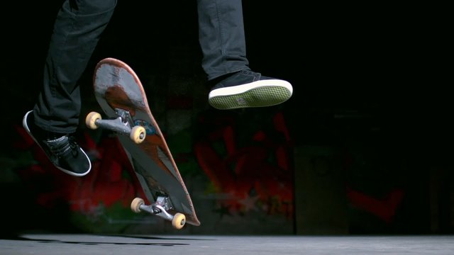 Skater performing 360 flip trick