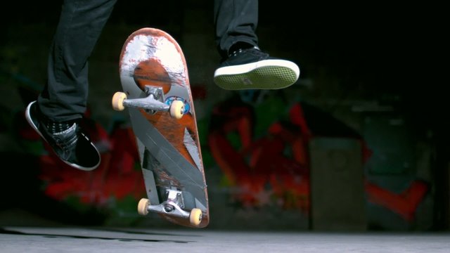 Skater performing 360 flip trick