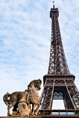 Eiffel tower and statue in Paris