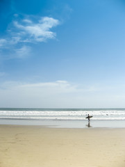 surfer on kuta beach bali indonesia