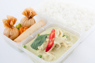 Thai take away food, green curry and spring roll with rice