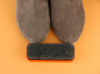 Brush for suede shoes, on color background