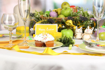 Serving Easter table on room background