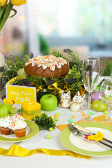 Serving Easter table on room background