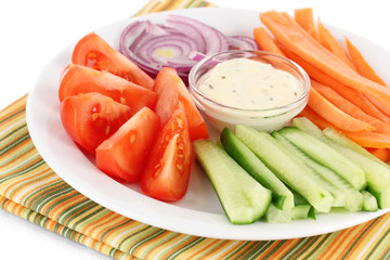 Assorted raw vegetables sticks in plate close up