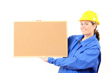 Woman engineer cork board in hand