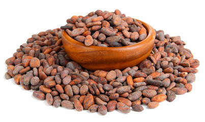 Cocoa beans in bowl, isolated on white