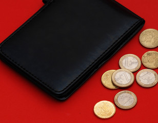 wallet with coins  on a red background